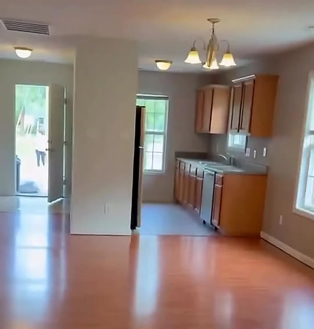 Vacant apartment kitchen and living area after a make-ready clean